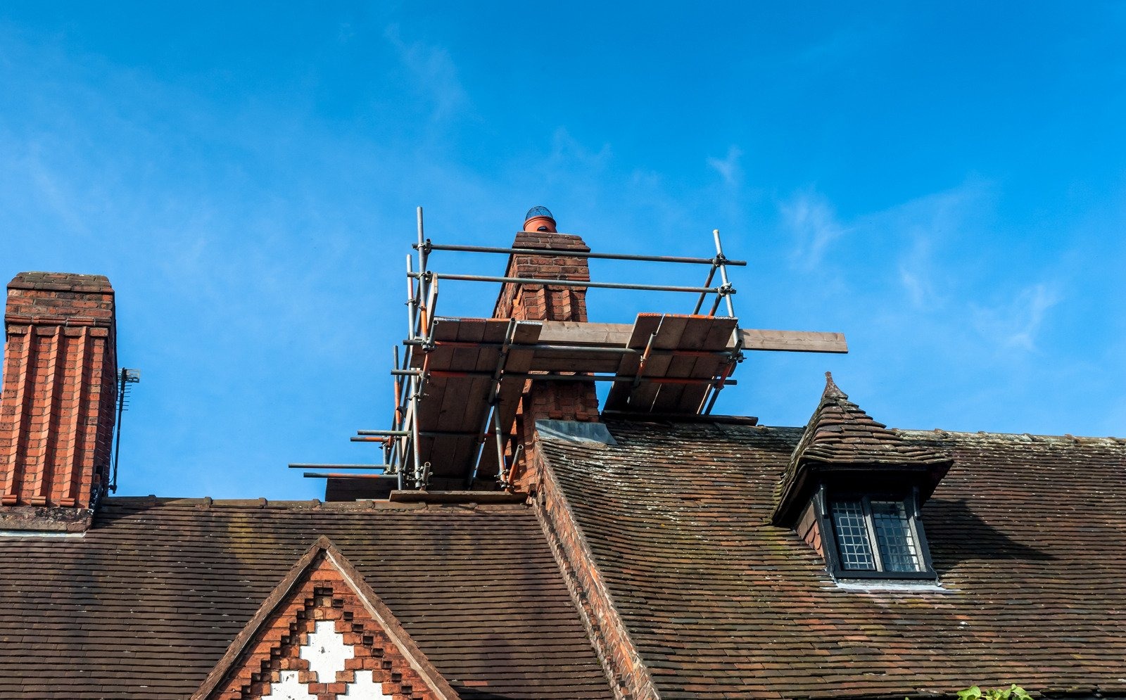 Frechette Chimney Sweeping inspecting a Westbrook chimney for damage.