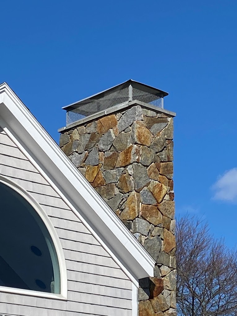 Masonry Stone Chimney with Chimney Cap Installed in Portsmouth, New Hampshire